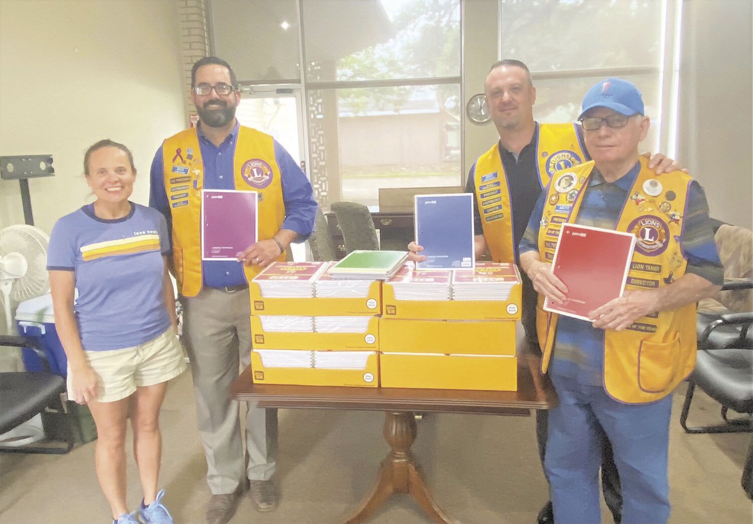 Lions donate notebooks to kick off church event